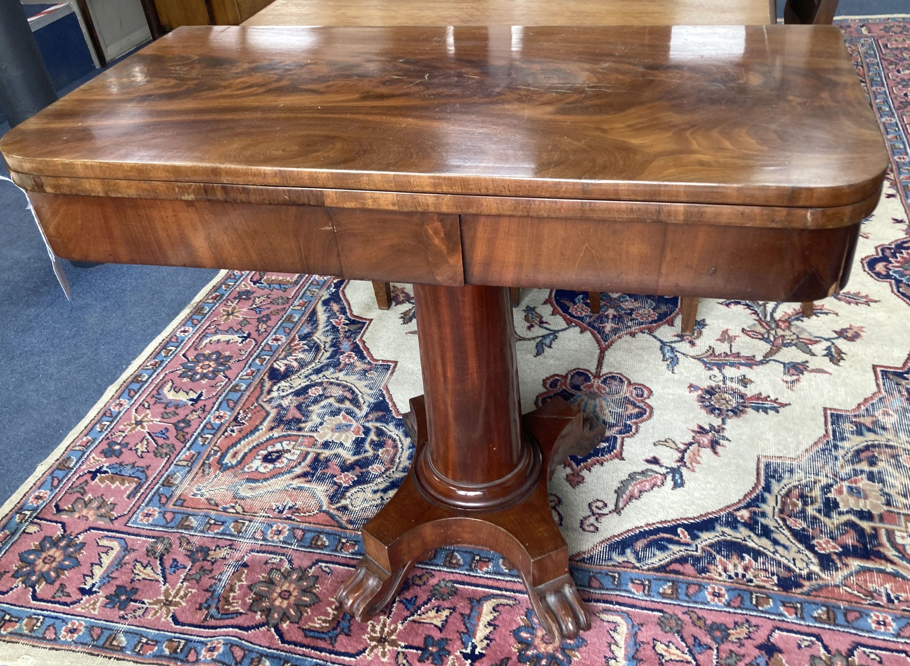 A Victorian mahogany folding card table in flamed veneers, 91cm diameter (91 x 45cm closed), 76cm high